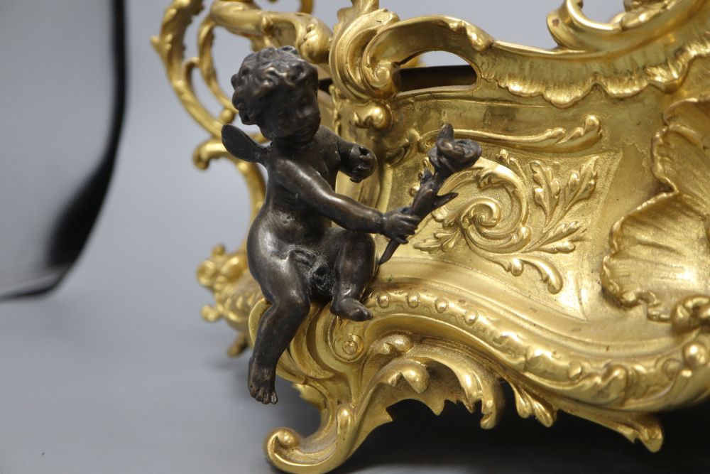 A Victorian style ormolu centrepiece, mounted with cherubs, length 43cm